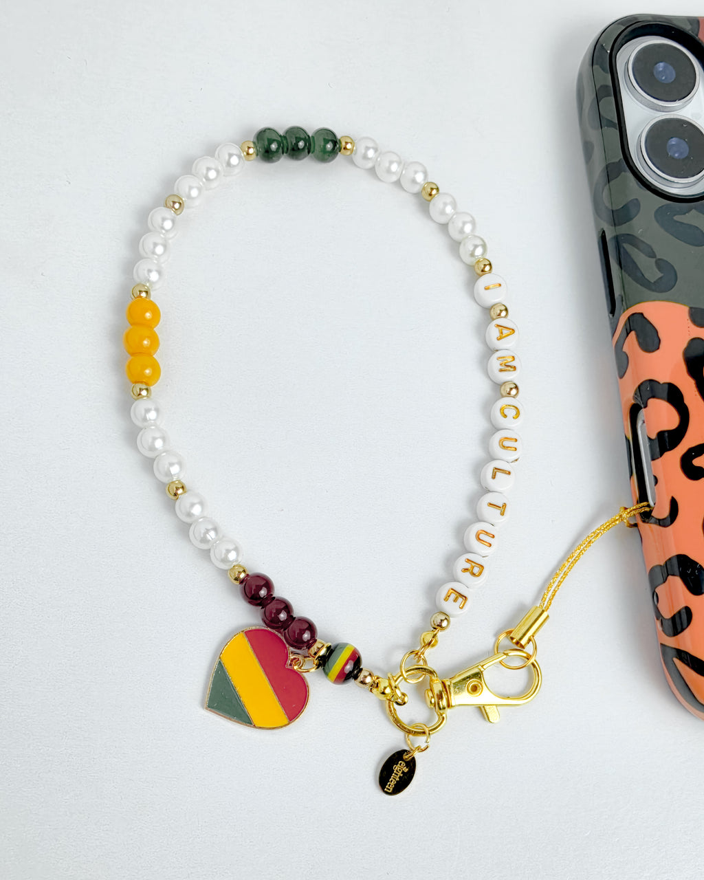 Bracelet with colorful charms on a light gray background