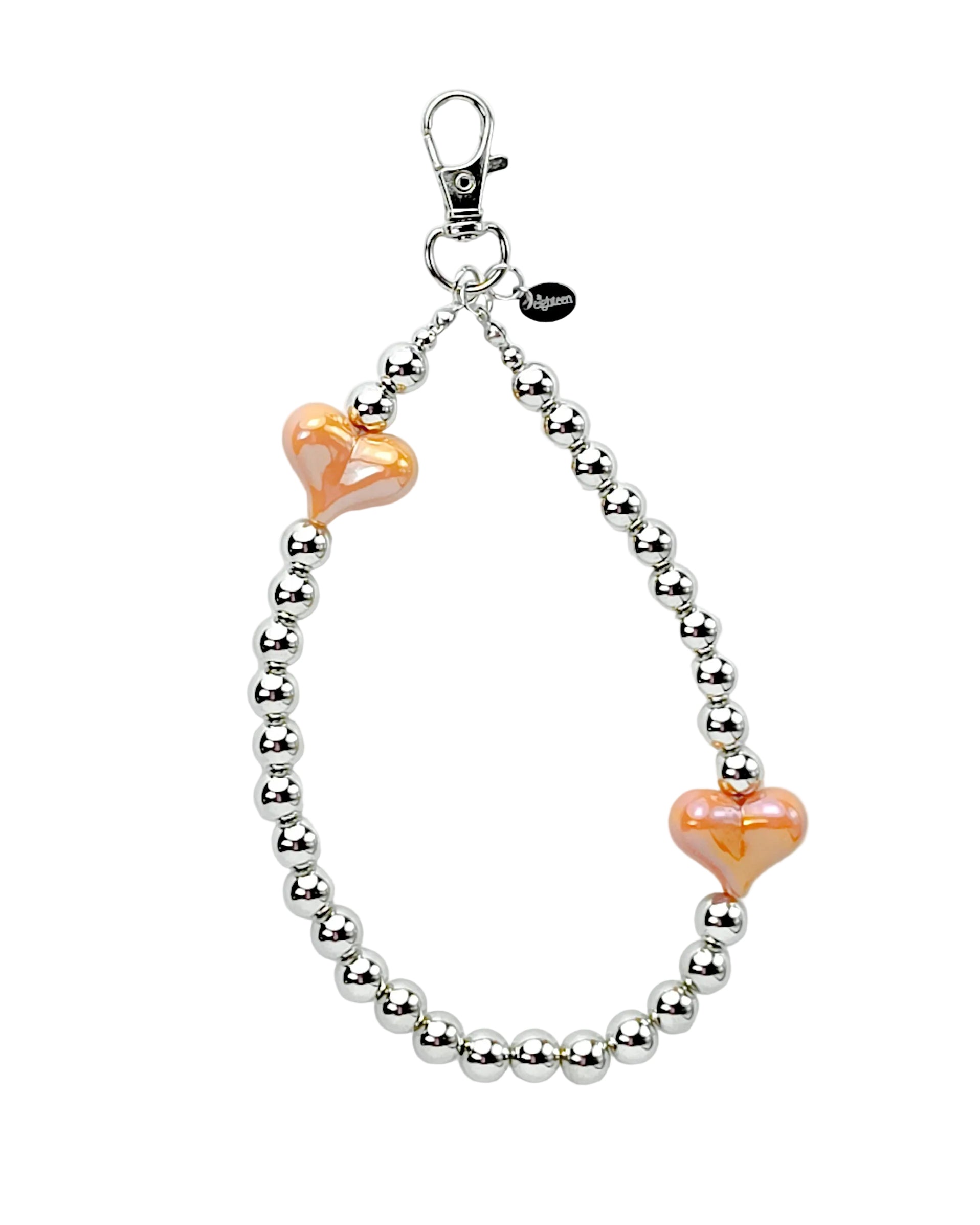 A silver beaded keychain or bag charm with two peach-colored heart-shaped beads and a silver lobster clasp, shown on a plain light gray background.