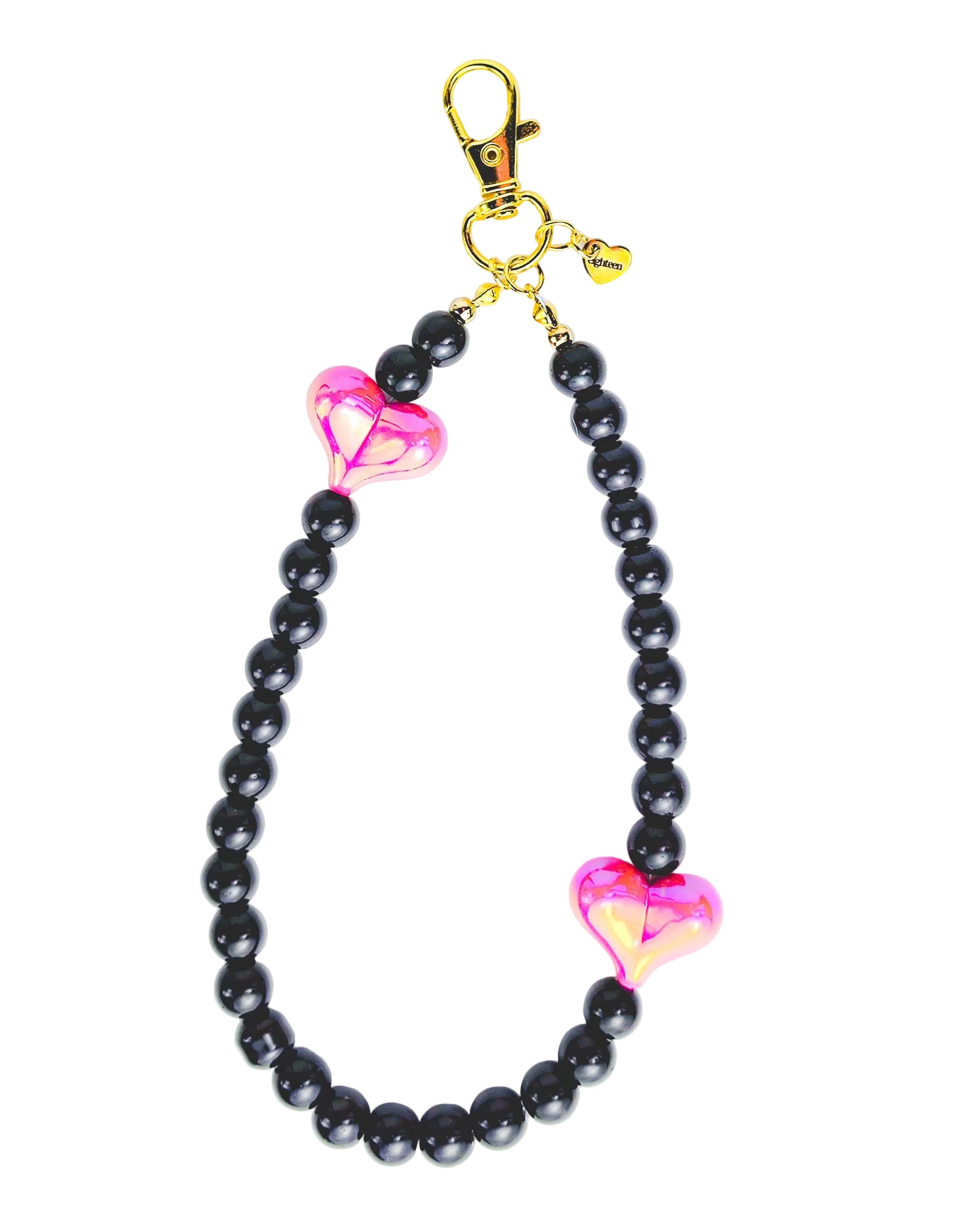 A black beaded phone strap or car keychain featuring two shiny pink heart-shaped beads and a gold-tone lobster clasp at the top, shown on a plain white background.