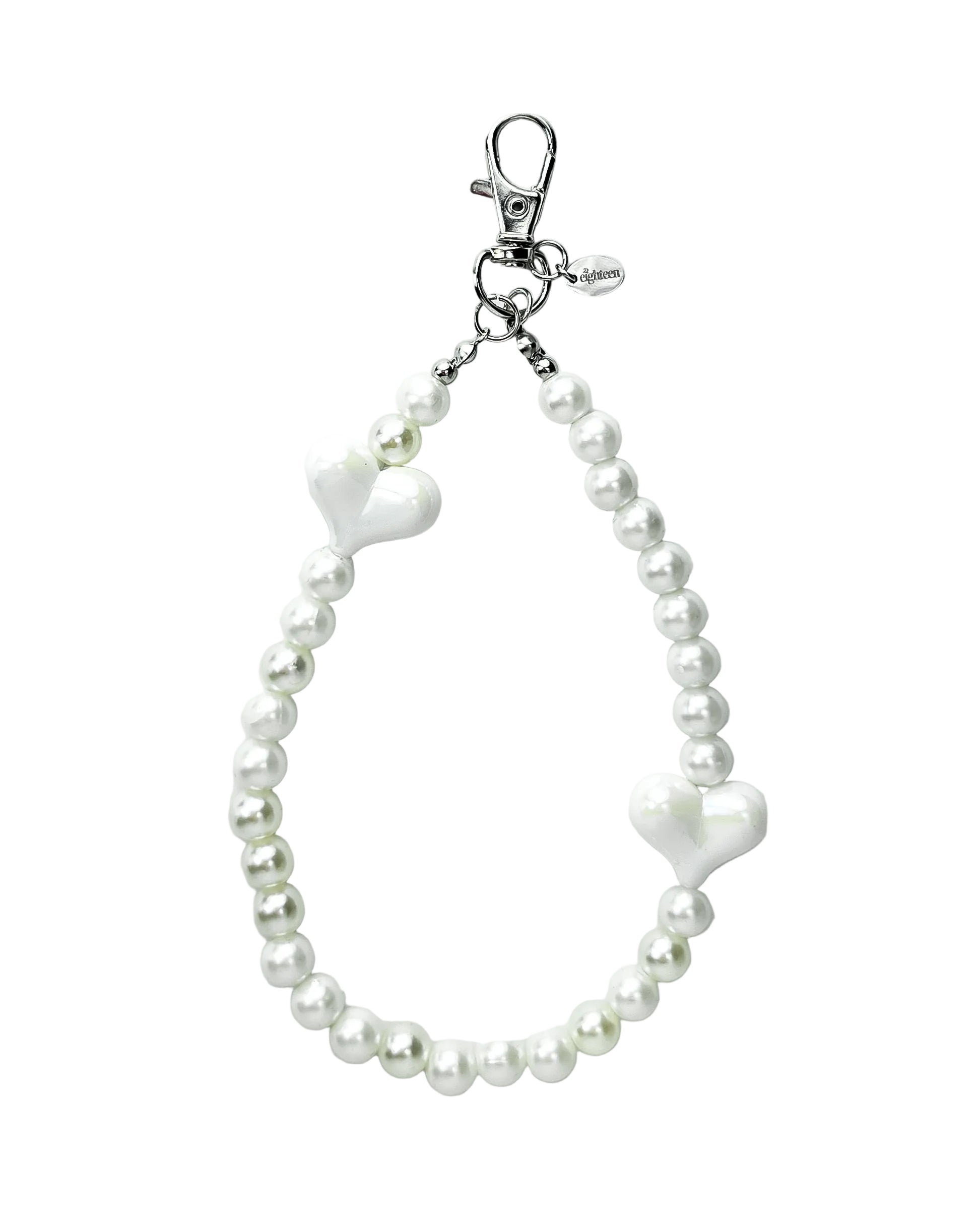 A white pearl beaded strap with two white heart-shaped charms and a silver lobster clasp, shown on a light gray background.