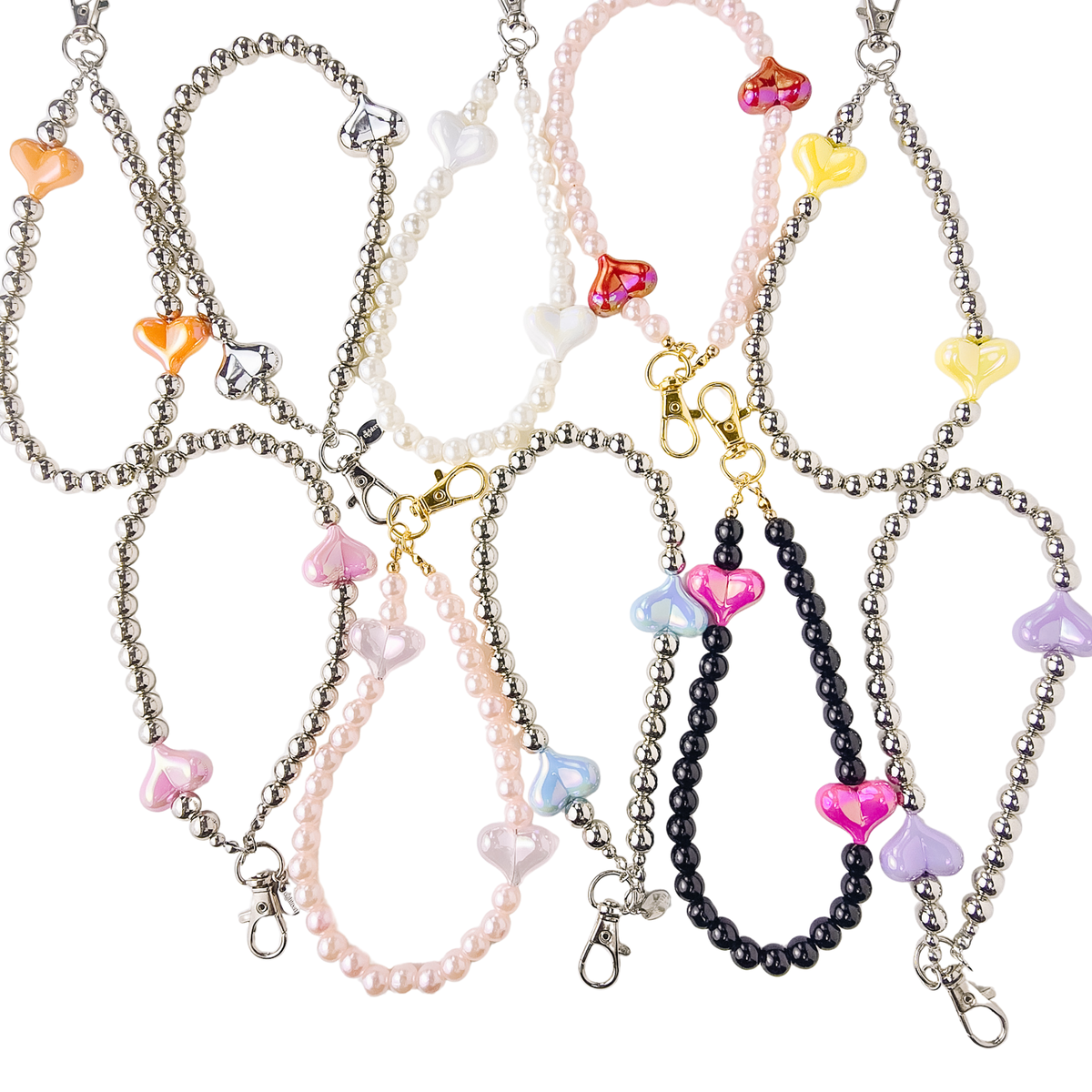 Ten beaded phone strap beads arranged on a white background. The set includes silver, pearl white, pale pink, and black beads, each decorated with translucent heart-shaped charms in pink, yellow, orange, blue, purple, and red.