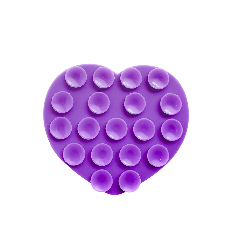 A Purple heart-shaped silicone phone suction grip with raised circular cups, shown on a plain white background.